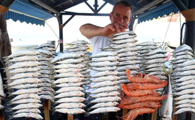 Malaga beach bars wage Sardine price war